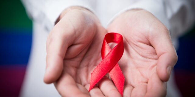 Hand-with-aids-ribbon-1.18.14-840×420